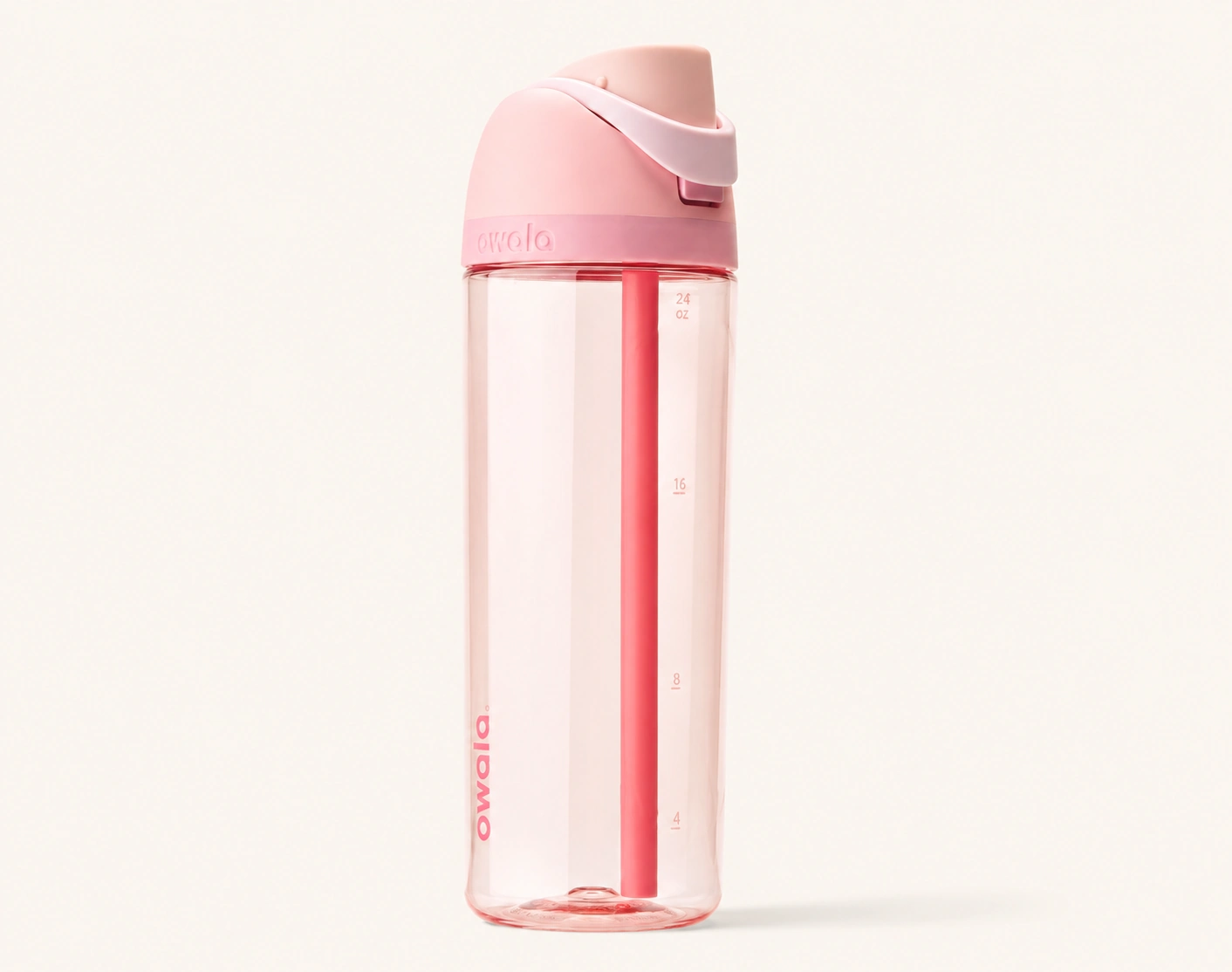 Clear pink Owala FreeSip water bottle with a built-in straw and locking lid on a plain cream background.