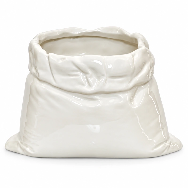 White ceramic vessel shaped like a crumpled bag with a folded uneven rim.